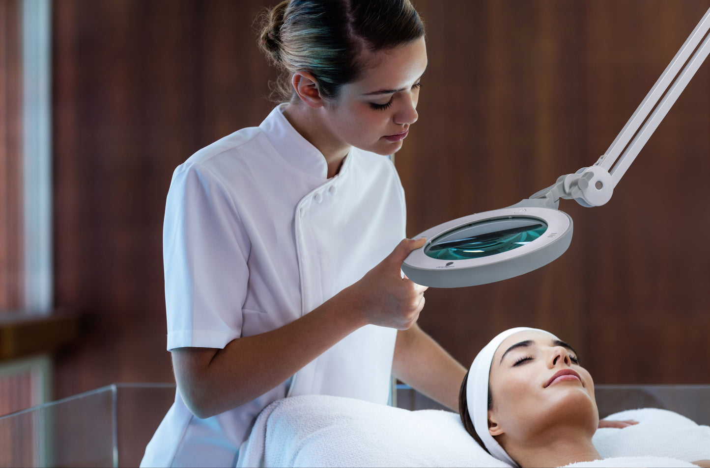 Cosmetologist using Daylight Omega 5 Magnifier Light