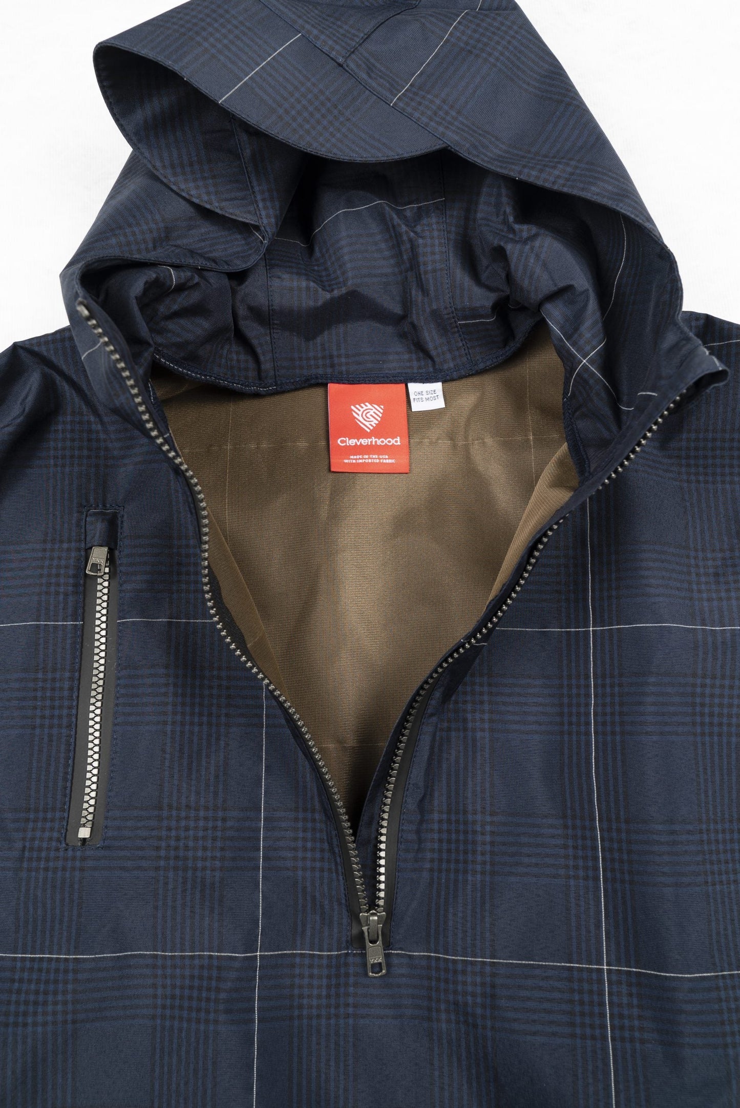Great for walking or riding travels and commutes. Made of sustainable, recycled polyester. Navy and white check with interwoven reflective thread creates a bright hi-vis grid that stands out on rainy days and nights. Elastic thumb loops keep the poncho secure when riding. Fully seam-sealed, and carefully crafted.