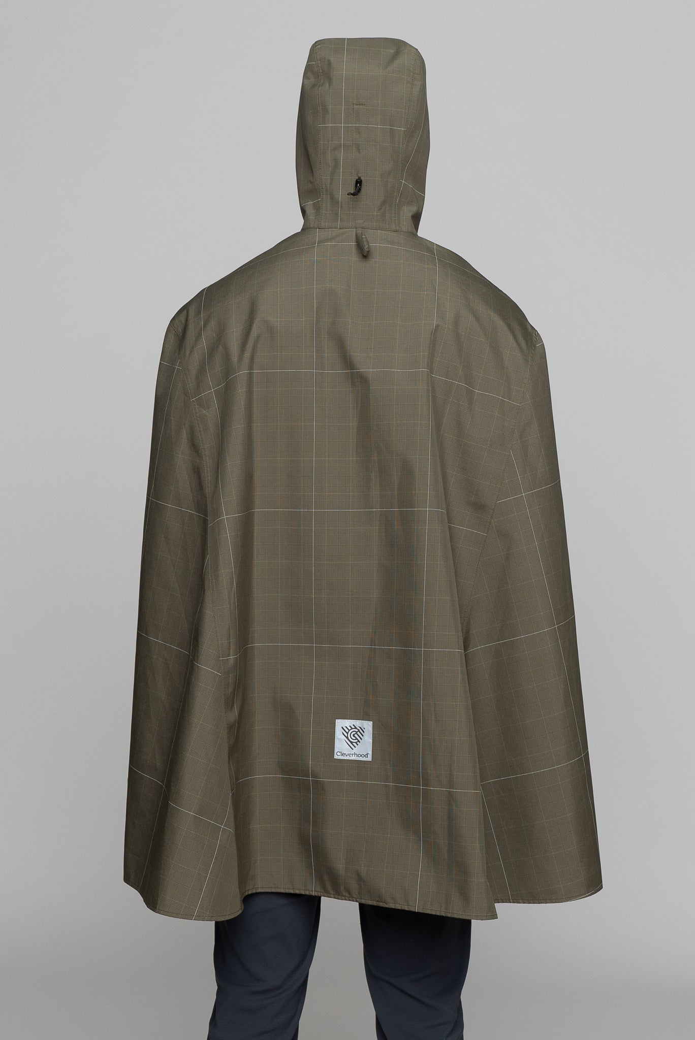 Great for walking or riding travels and commutes. Made of sustainable, recycled polyester. Navy and white check with interwoven reflective thread creates a bright hi-vis grid that stands out on rainy days and nights. Elastic thumb loops keep the poncho secure when riding. Fully seam-sealed, and carefully crafted.