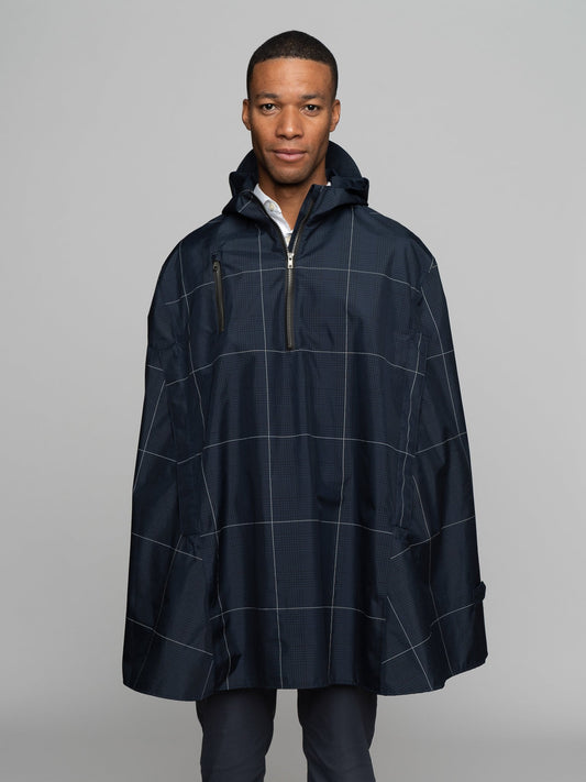 Great for walking or riding travels and commutes. Made of sustainable, recycled polyester. Navy and white check with interwoven reflective thread creates a bright hi-vis grid that stands out on rainy days and nights. Elastic thumb loops keep the poncho secure when riding. Fully seam-sealed, and carefully crafted.